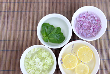 Aromatherapy treatment bowls with flowers and perfumed water