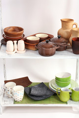 Different tableware on shelf, close up