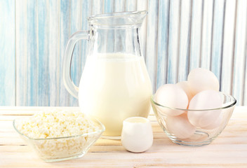 Tasty dairy products on wooden table