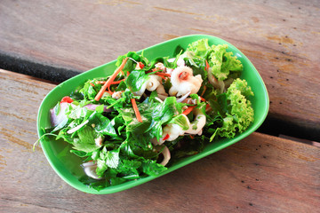 Thai spicy vegetable and chopped pork salad (Yum Pak Wan)