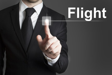 businessman pressing virtual button flight