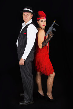 Dangerous bonny and clyde gangster with 1920 style clothes stand