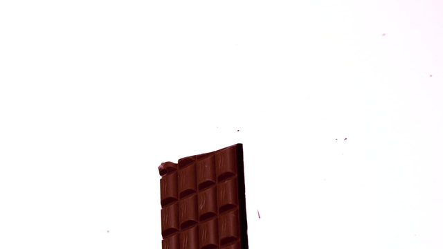 Arrow shooting through a chocolate bar