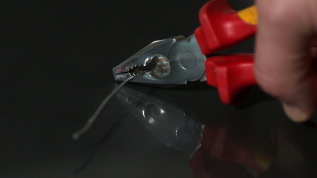 Hand cutting wire with pliers