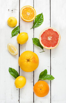 Citrus fruits (lemon, grapefruit and orange) on wood