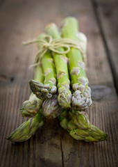 Fresh asparagus on the wooden table closeup