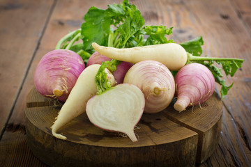 Fresh turnip and white radish on the wooden table