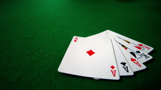 Full house hand falling on casino table