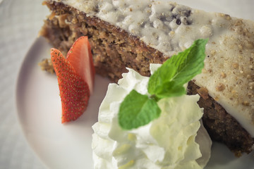 Homemade carrot cake with lemon glaze.
