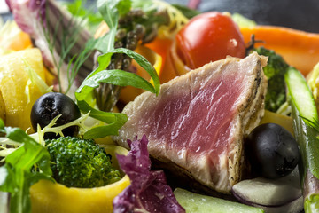 A variety of fresh and seasonal vegetables with grilled tuna