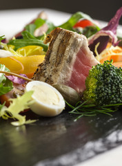 A variety of fresh and seasonal vegetables with grilled tuna