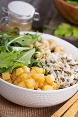 Salad with baked potato, rice and greens