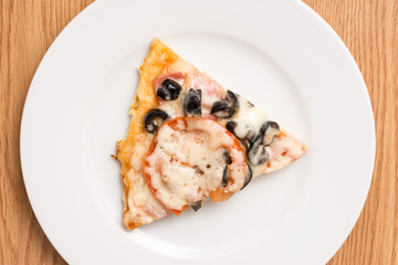 Classic Italian Pizza Slice Served On White Plate