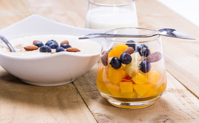 Fresh fruity dessert with bowl of porridge
