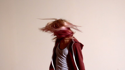 Sporty blonde shaking her hair