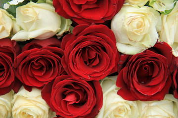 Red and white roses in a wedding arrangement