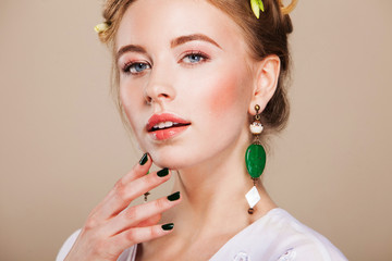 beautiful woman with perfect makeup wearing earrings