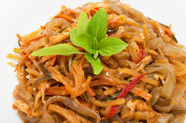 Vegetarian stir fry noodle plate on white background