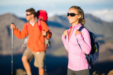 Man and woman hiking on beautiful mountain trail © EpicStockMedia