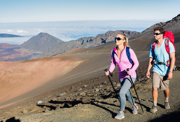 Man and woman hiking on beautiful mountain trail