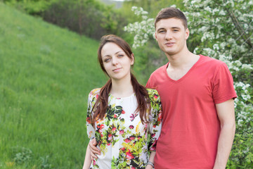 Smiling young couple on a spring walk