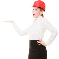 Female engineer woman architect in red safety helmet isolated