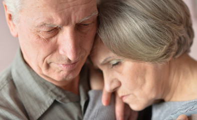 Sad elder couple