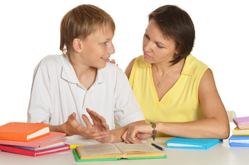 Fototapeta premium Mother helping her son