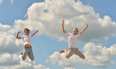Obraz premium Two boys jumping