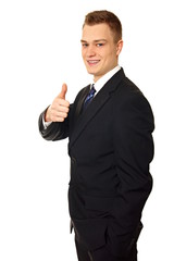 Young man in suit shows you thumb up on isolated background