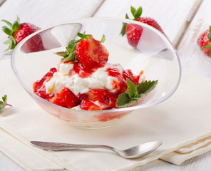dessert with strawberries and mint leaf