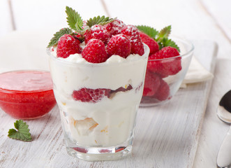 dessert with raspberries and mint leaf