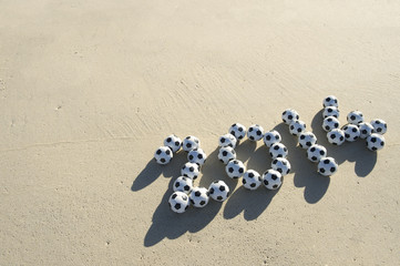 Naklejka premium Soccer 2014 Footballs Message Beach