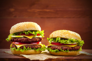 Two hamburgers on wood
