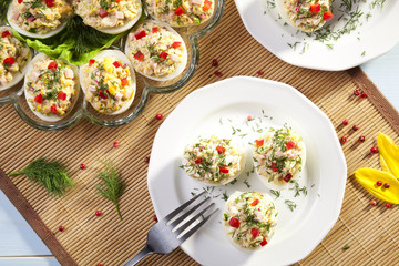 stuffed eggs with ham, red pepper and dill