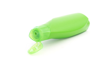 green plastic shampoo bottle with opened flip top lid