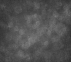 Black scratched grunge stucco wall background or texture