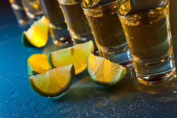 tequila and lime on glass table