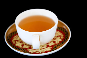 cup of tea on black background
