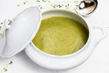 Vegetable soup in white porcelain tureen - obrazy, fototapety, plakaty