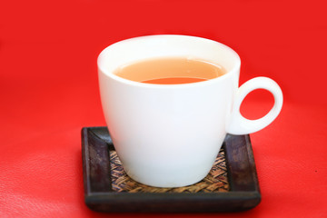 cup of tea on red background