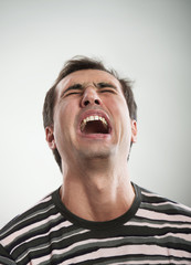 Man cries opening the mouth
