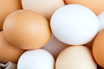 farm eggs in a basket on wooden table