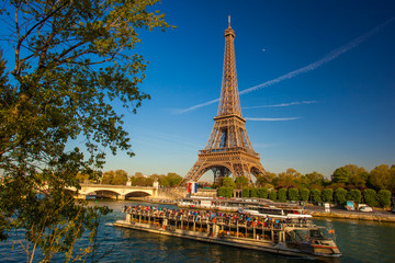 Eiffel Tower with boat on Seine in Paris, France