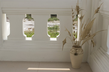 beige flower vase on balcony