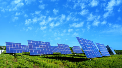 Lots of Solar Panels, with beautiful Clouds - 64906526