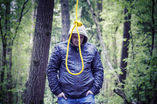 The noose before the man in the dark woods