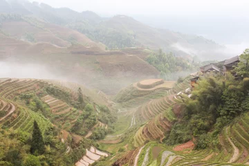 Foto op Canvas Dragon Ridge Terrace of rice fields at fog weather © johnbeatl