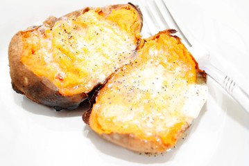 Delicious Sweet Potatoes with Melted Butter and Pepper