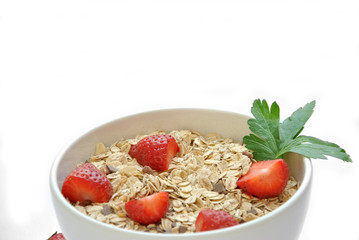 bowl of cereal with milk and strawberries